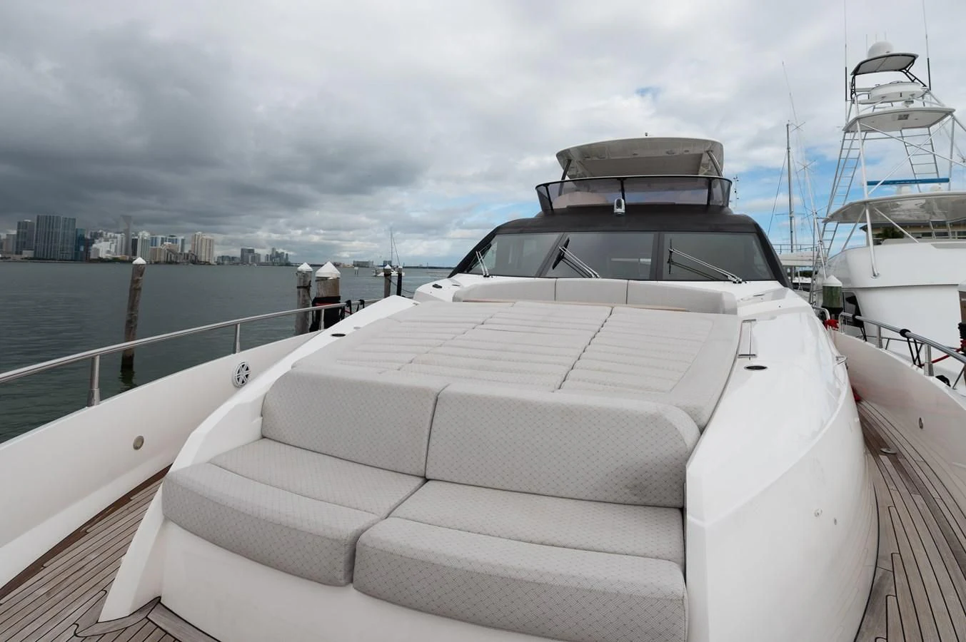 a white boat on a dock aboard SUNSEEKER 75 YACHT Yacht for Sale
