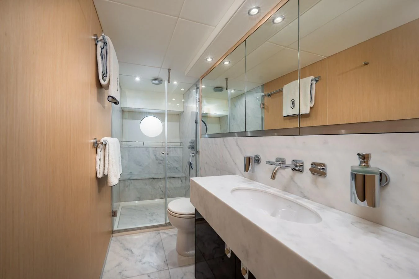 a bathroom with a large mirror aboard SUNSEEKER 75 YACHT Yacht for Sale