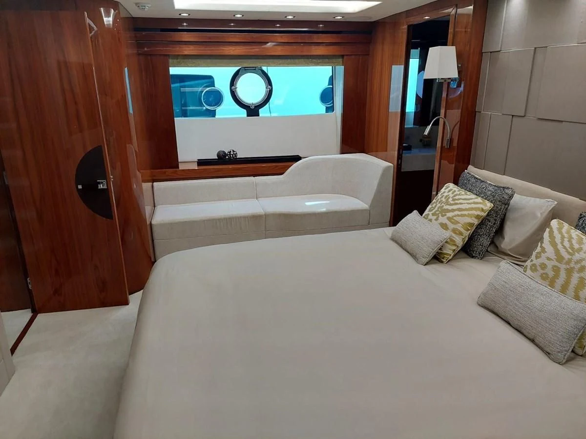 a room with a bed and a mirror aboard SUNSEEKER 75 YACHT Yacht for Sale