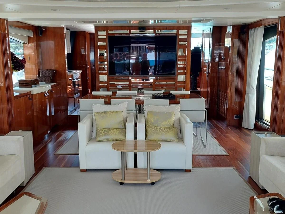 a living room with a large screen aboard SUNSEEKER 75 YACHT Yacht for Sale