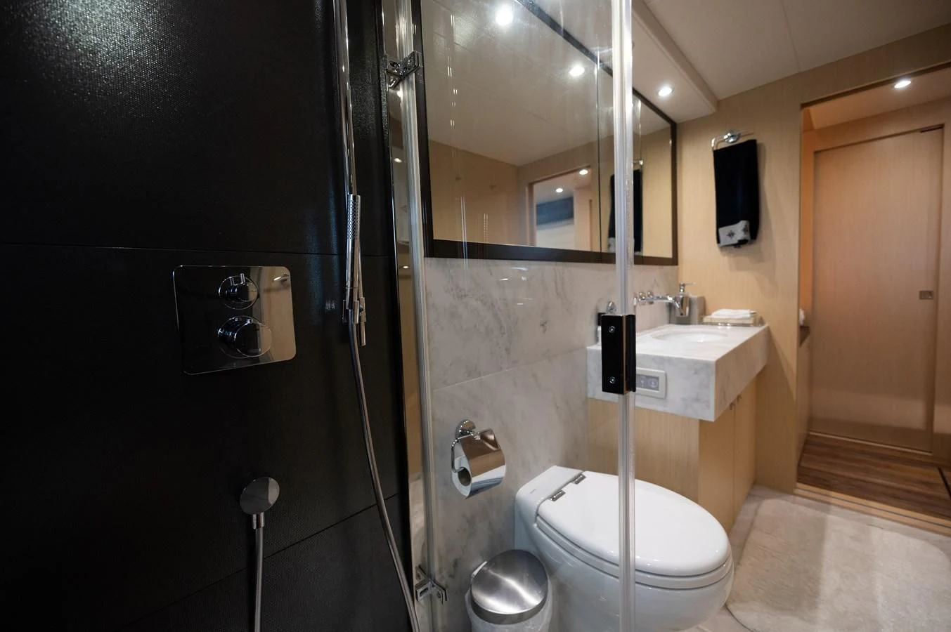 a bathroom with a glass shower aboard SUNSEEKER 75 YACHT Yacht for Sale