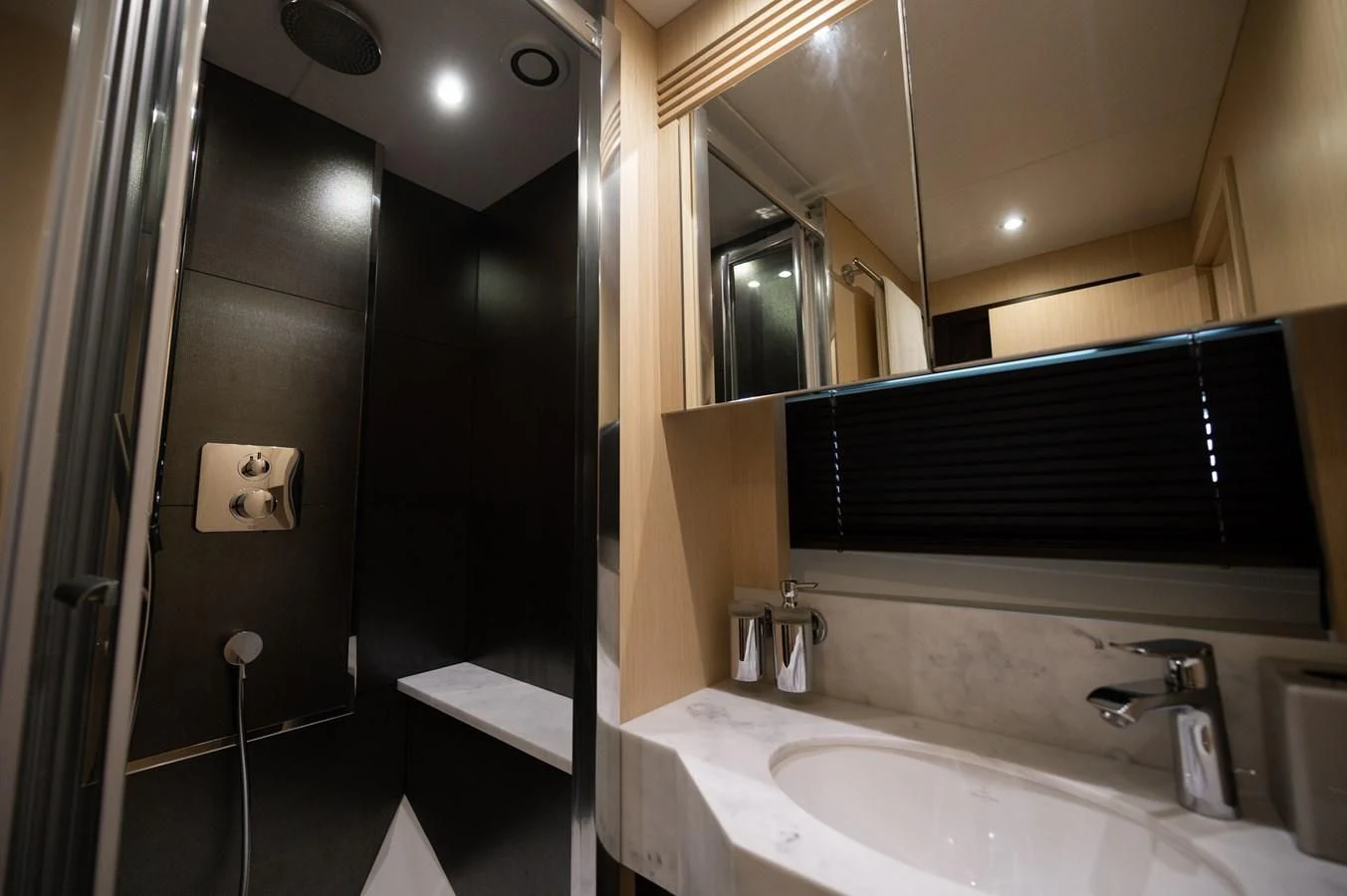 a bathroom with a sink and a mirror aboard SUNSEEKER 75 YACHT Yacht for Sale
