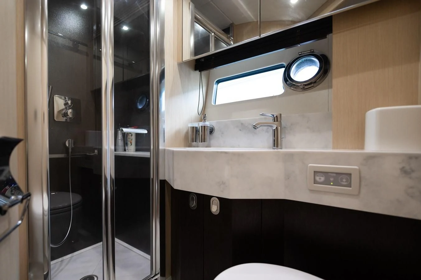 a bathroom with a glass shower aboard SUNSEEKER 75 YACHT Yacht for Sale