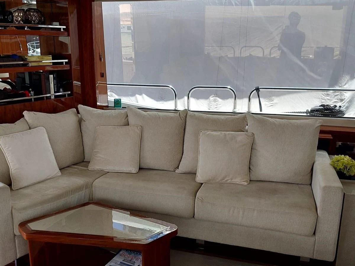 a couch with a table in front of it aboard SUNSEEKER 75 YACHT Yacht for Sale