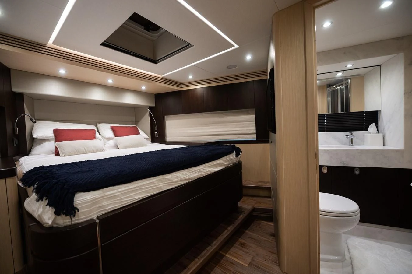 a room with a bed and a sink aboard SUNSEEKER 75 YACHT Yacht for Sale