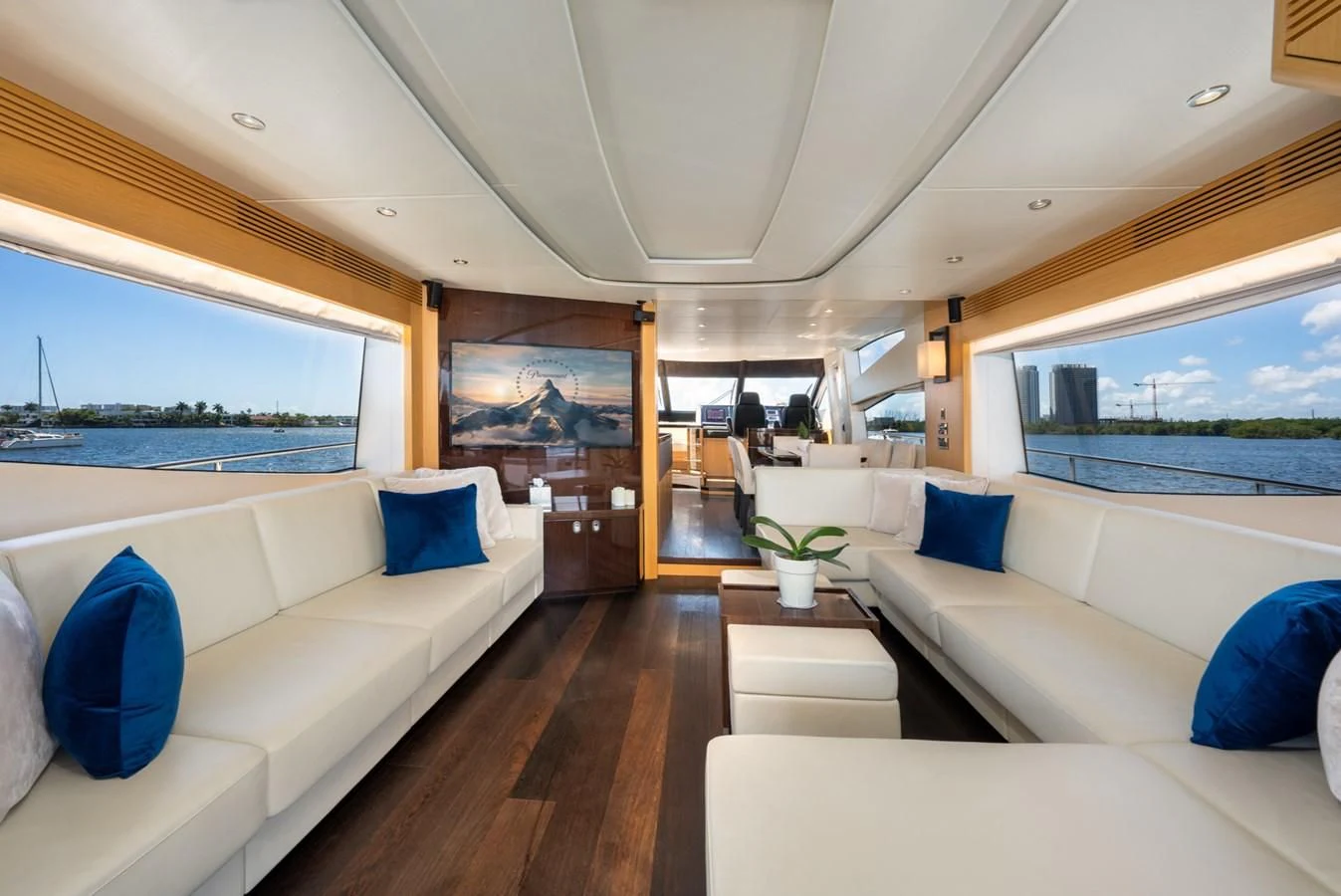 a living room with a large window aboard SUNSEEKER 75 YACHT Yacht for Sale