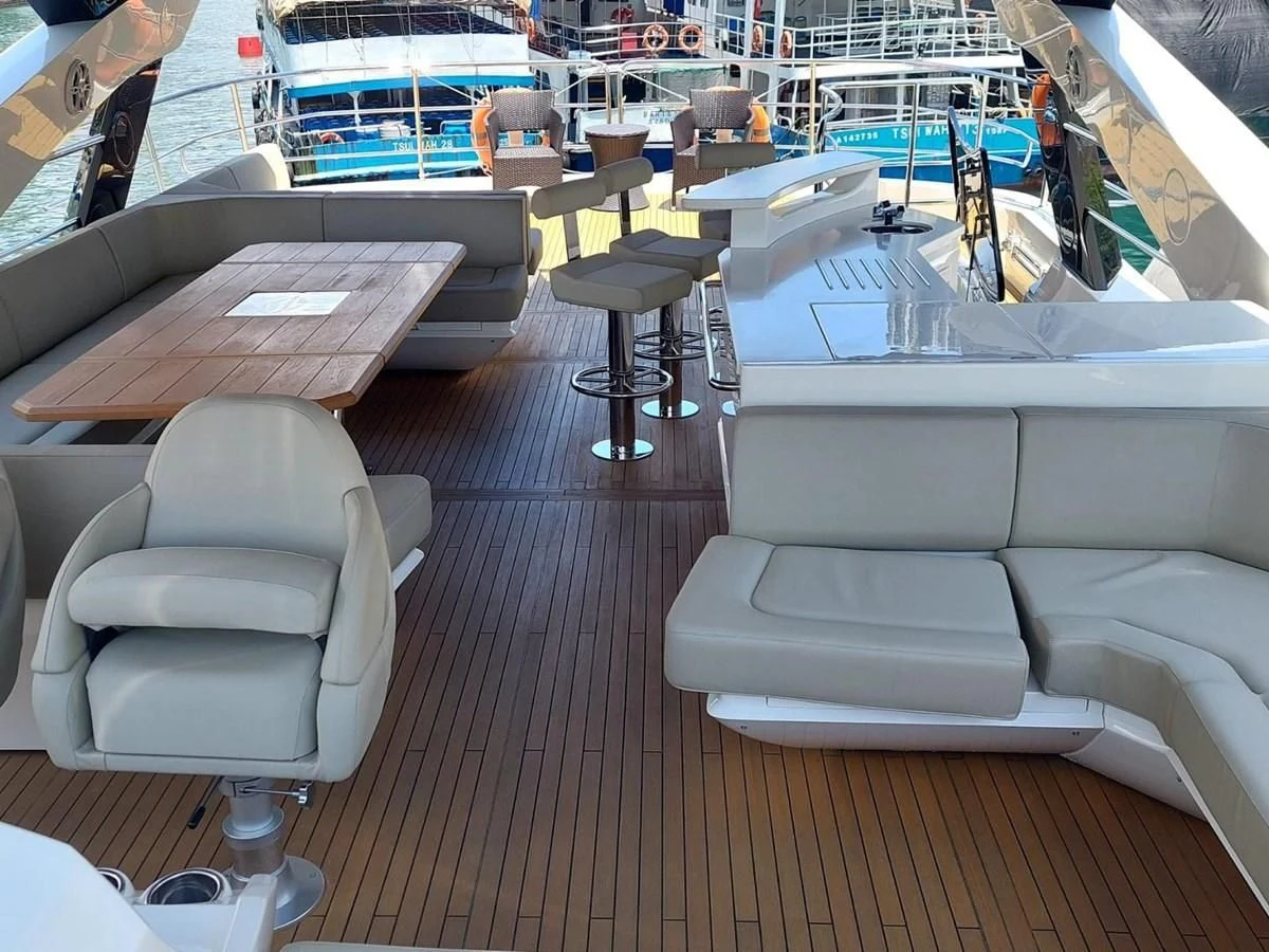 a room with a table chairs and a bench aboard SUNSEEKER 75 YACHT Yacht for Sale