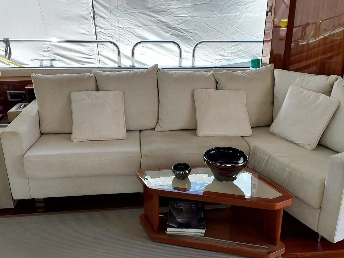a couch with a coffee table aboard SUNSEEKER 75 YACHT Yacht for Sale