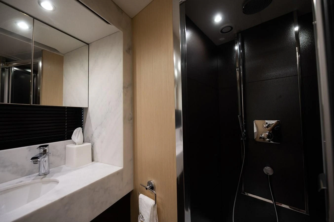 a bathroom with a sink and mirror aboard SUNSEEKER 75 YACHT Yacht for Sale