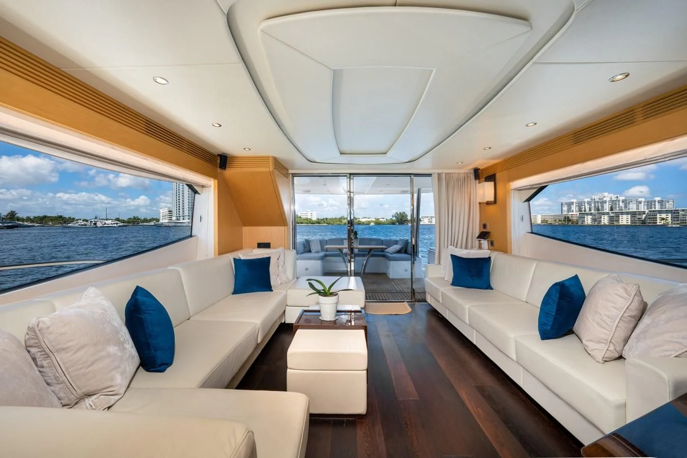 a room with a couch and a table and a large window aboard SUNSEEKER 75 YACHT Yacht for Sale
