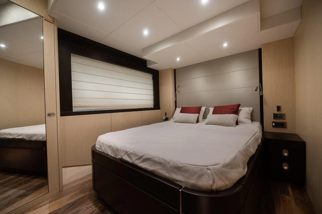 a room with a bed and a window aboard SUNSEEKER 75 YACHT Yacht for Sale