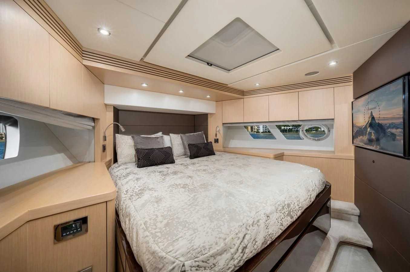 a bedroom with a bed and a television aboard SUNSEEKER 75 YACHT Yacht for Sale