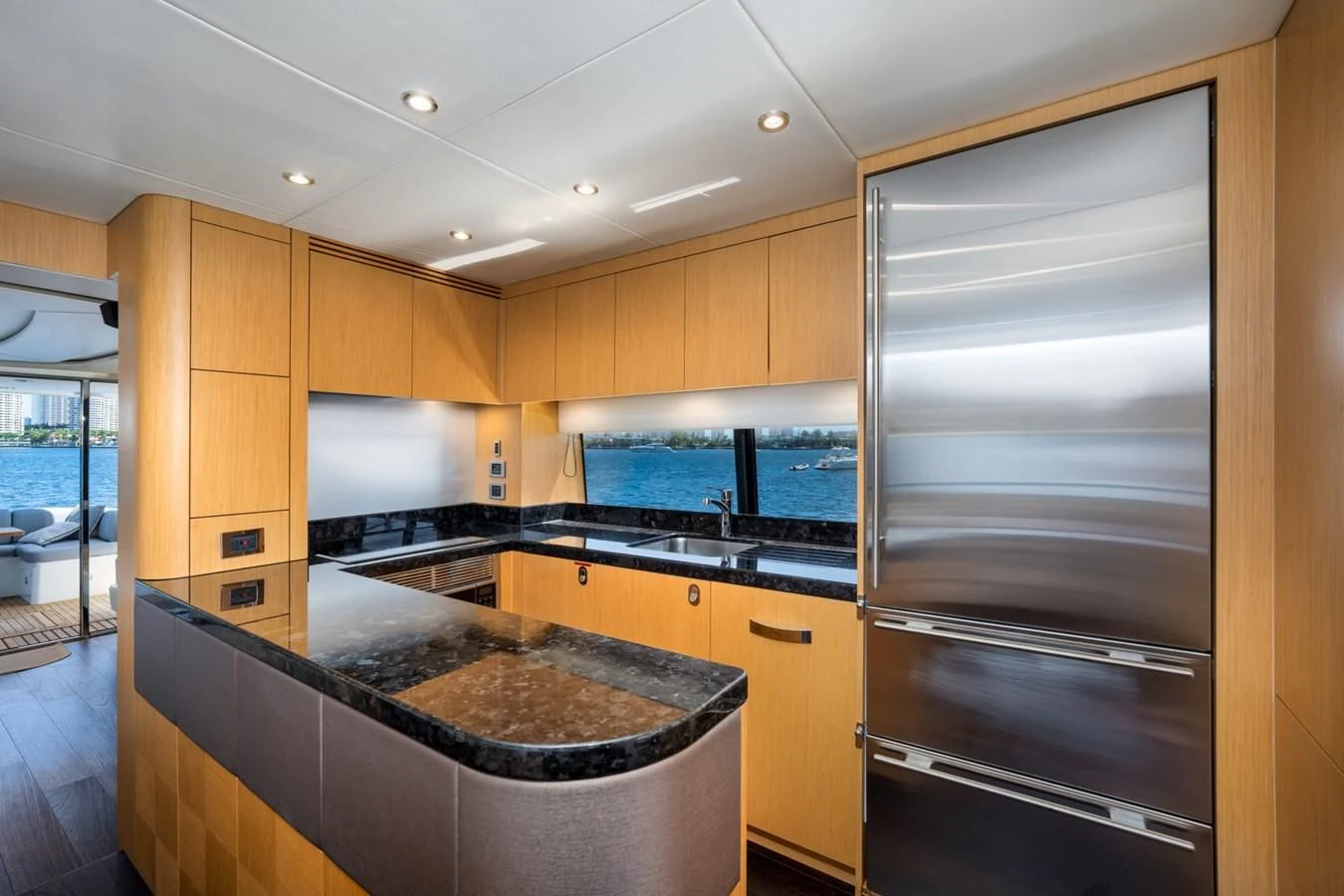 a kitchen with a large stainless steel oven and a large glass window aboard SUNSEEKER 75 YACHT Yacht for Sale