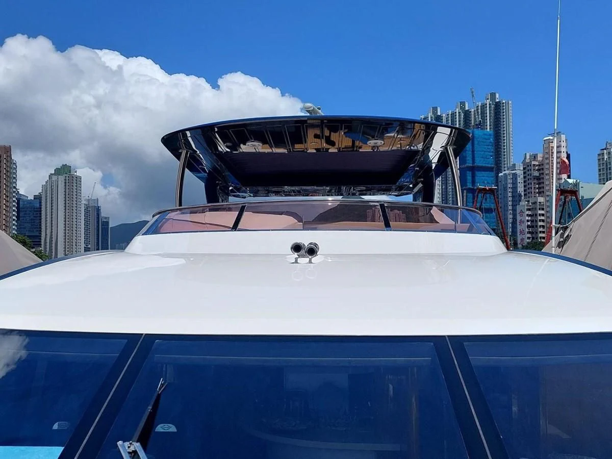 a boat with a large ship in the water aboard SUNSEEKER 75 YACHT Yacht for Sale