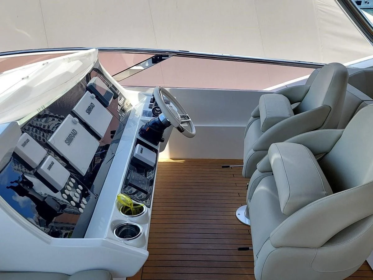 a car with a screen and a seat aboard SUNSEEKER 75 YACHT Yacht for Sale
