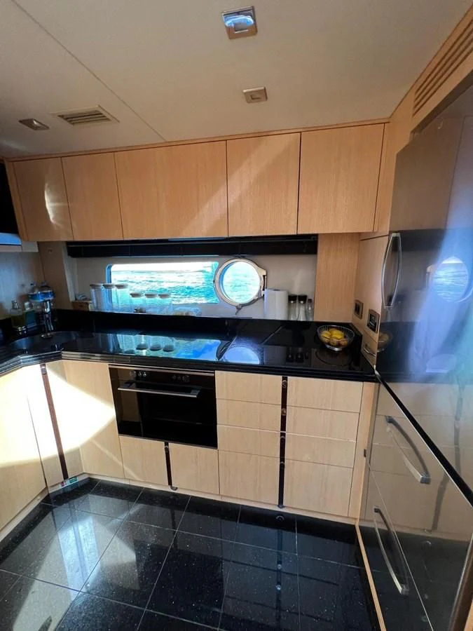 a kitchen with a stove and oven aboard SUNSEEKER 75 YACHT Yacht for Sale