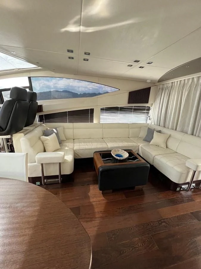 a living room with a couch and a table aboard SUNSEEKER 75 YACHT Yacht for Sale