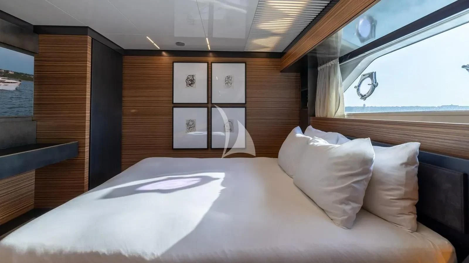 a bed with white sheets and pillows aboard DATE NIGHT Yacht for Sale