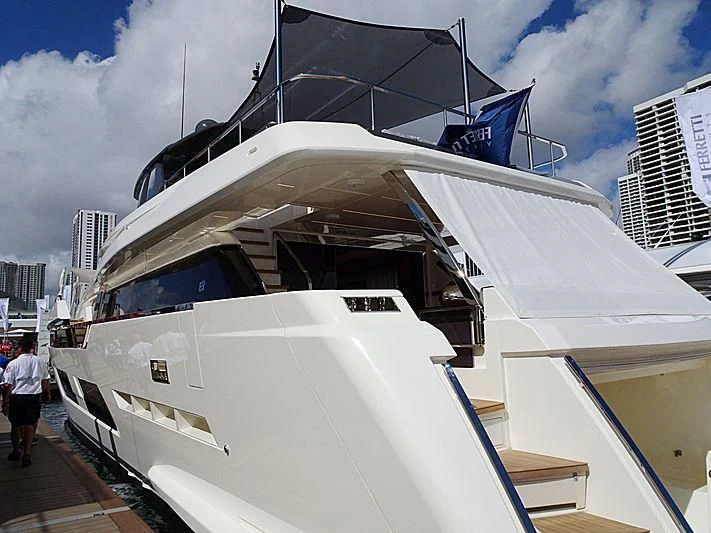 a white boat with a black and white roof aboard DATE NIGHT Yacht for Sale