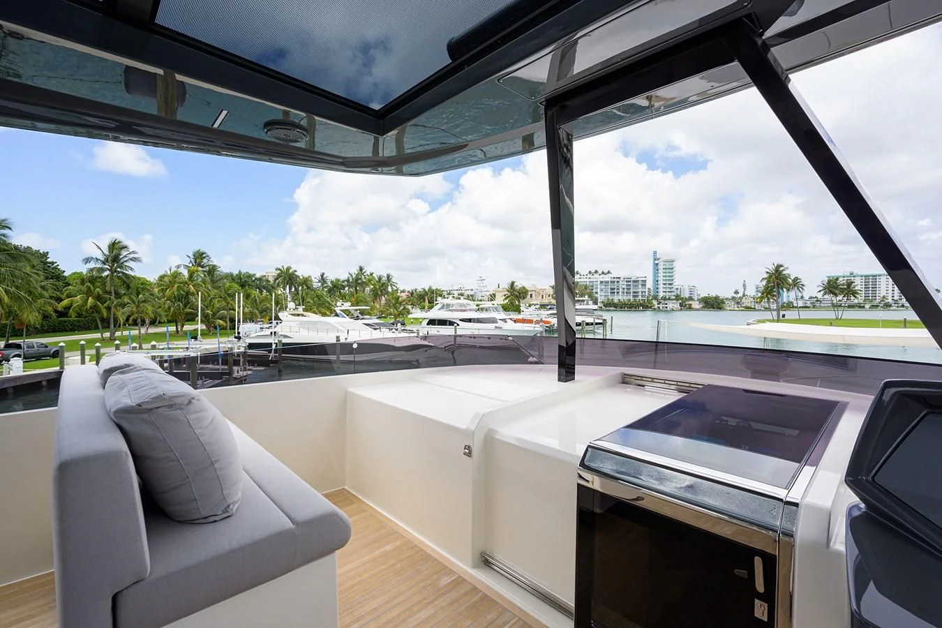 a room with a view of a beach and a pool aboard DATE NIGHT Yacht for Sale