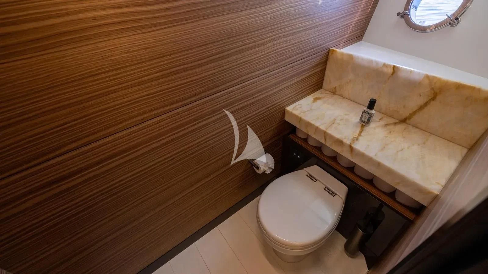 a toilet in a wooden bathroom aboard DATE NIGHT Yacht for Sale