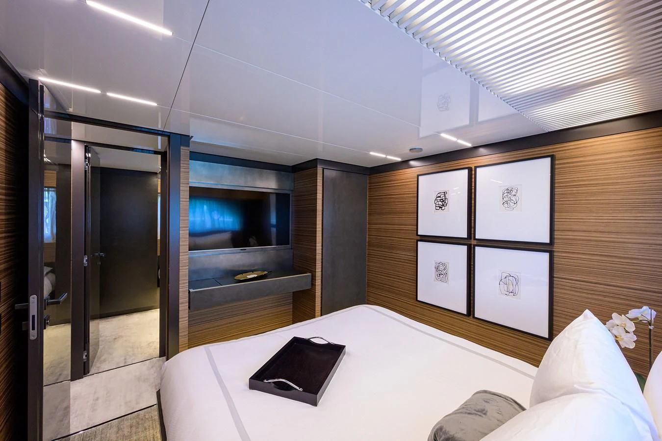 a bedroom with a bed and a television aboard DATE NIGHT Yacht for Sale