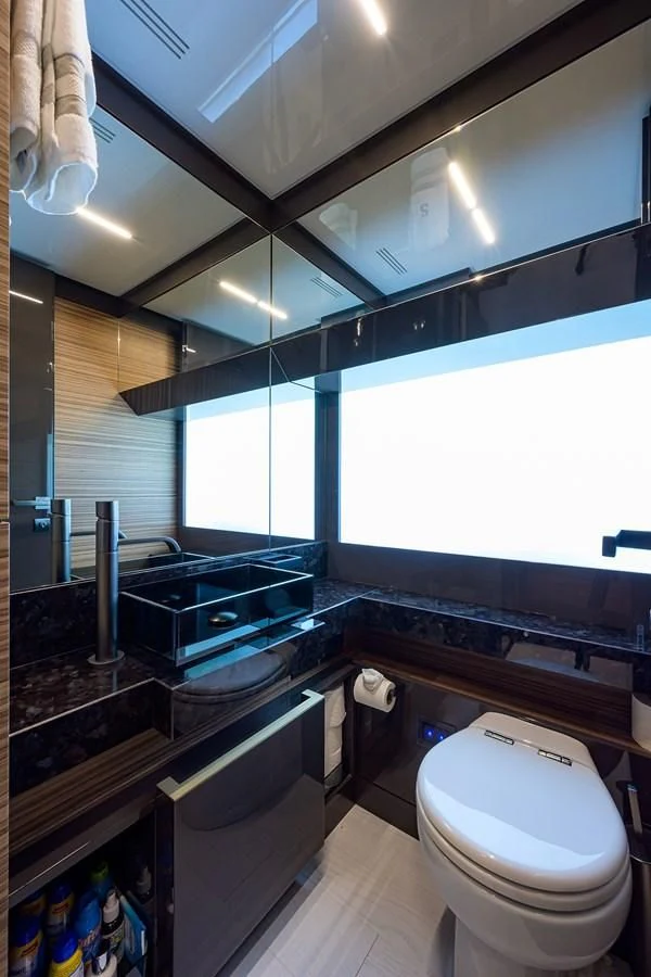 a bathroom with a glass shower aboard DATE NIGHT Yacht for Sale