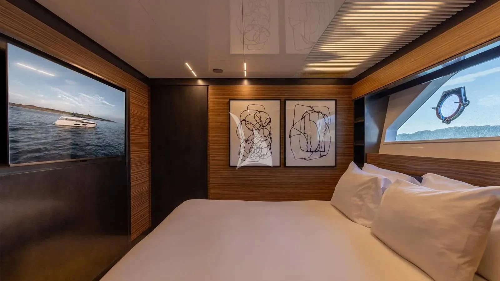 a bed with a painting on the wall aboard DATE NIGHT Yacht for Sale