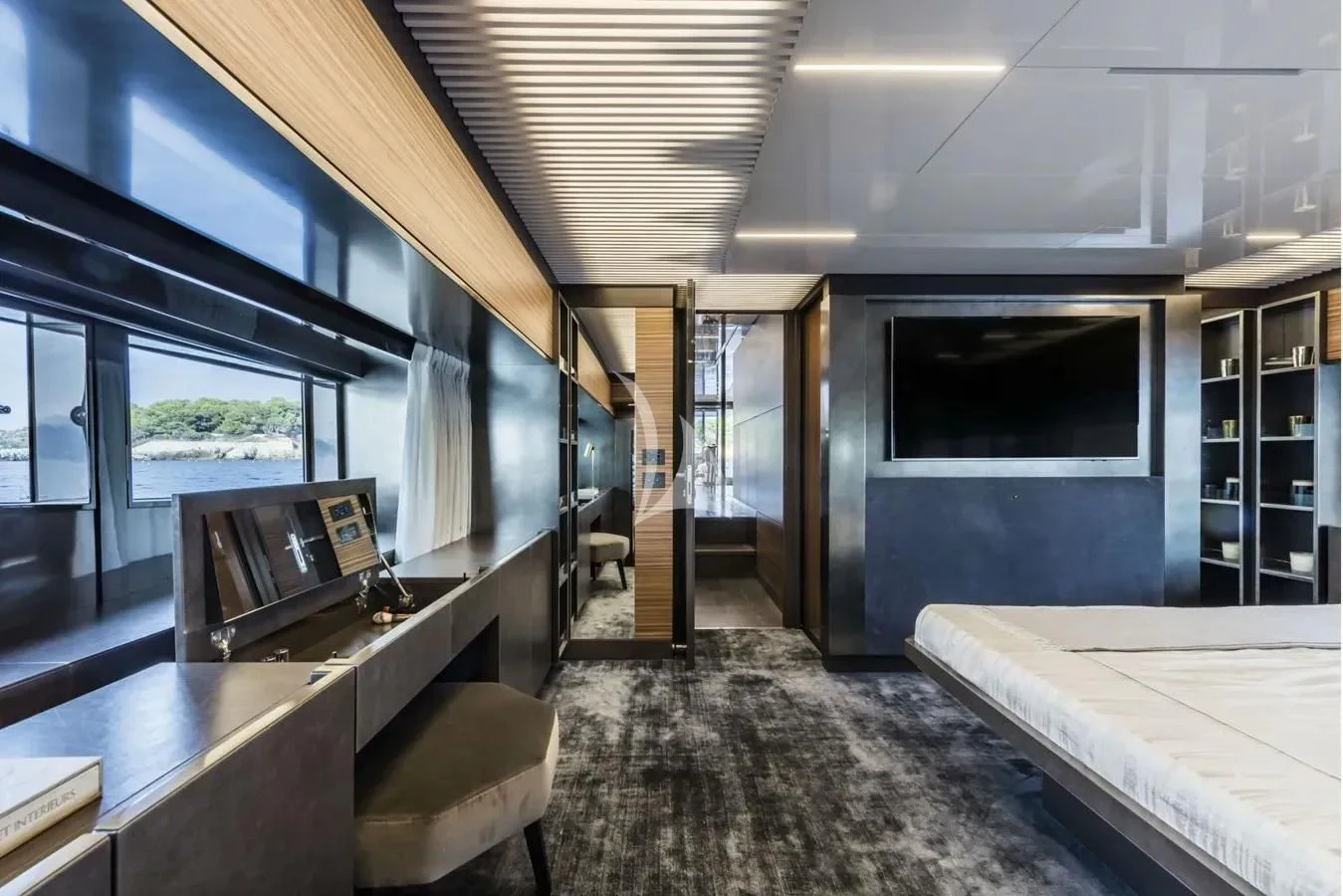 a room with a bed and a tv aboard DATE NIGHT Yacht for Sale