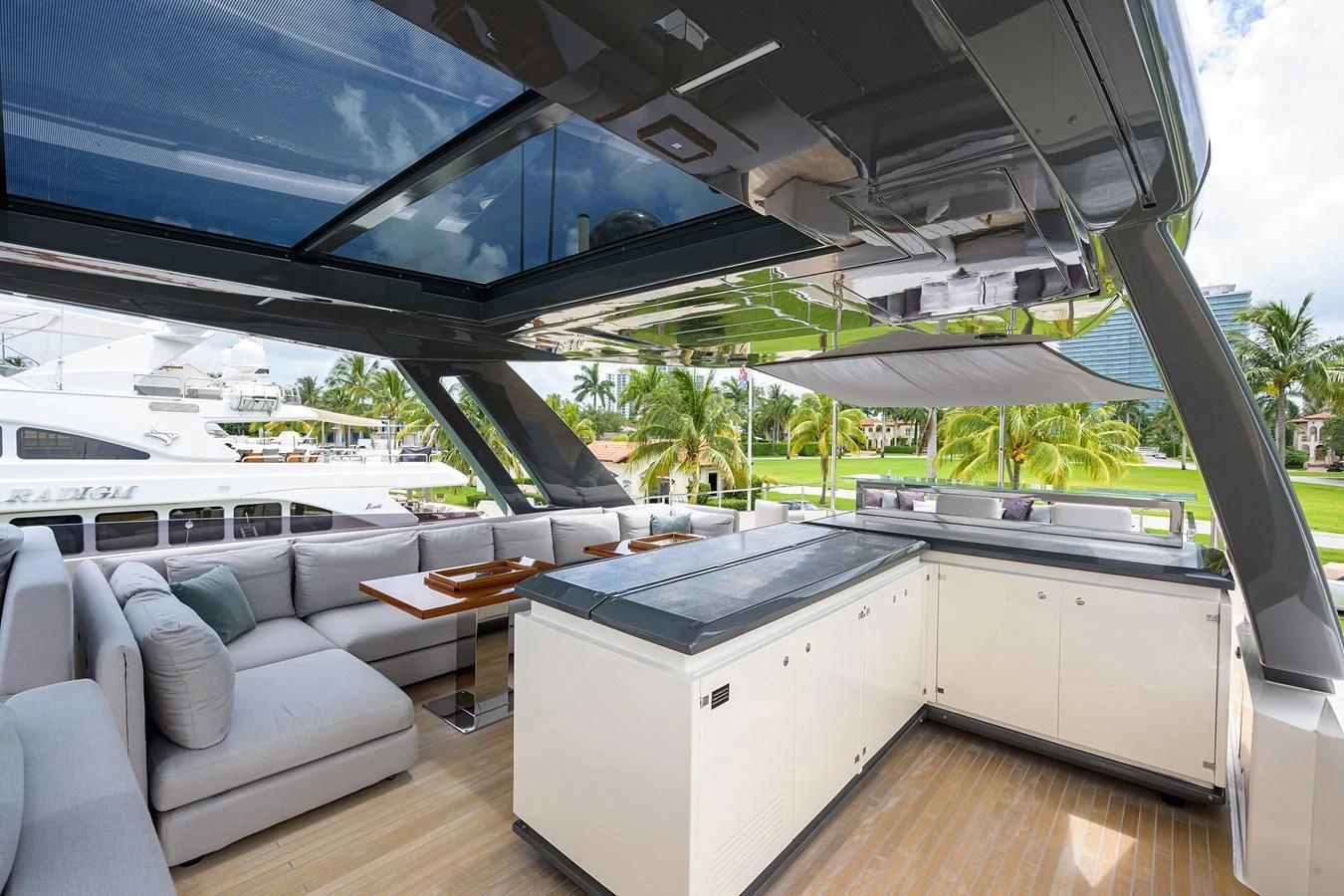a room with a couch and a table and a large window aboard DATE NIGHT Yacht for Sale