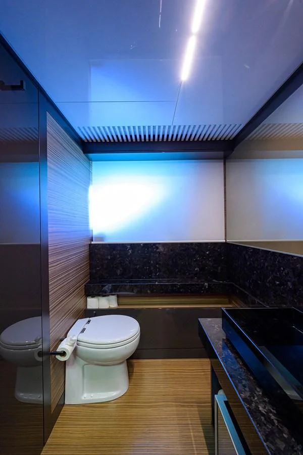 a bathroom with a tub and toilet aboard DATE NIGHT Yacht for Sale
