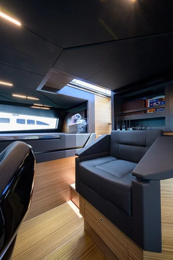 a living room with a couch and a tv aboard DATE NIGHT Yacht for Sale