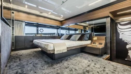 a room with a bed and a desk aboard DATE NIGHT Yacht for Sale