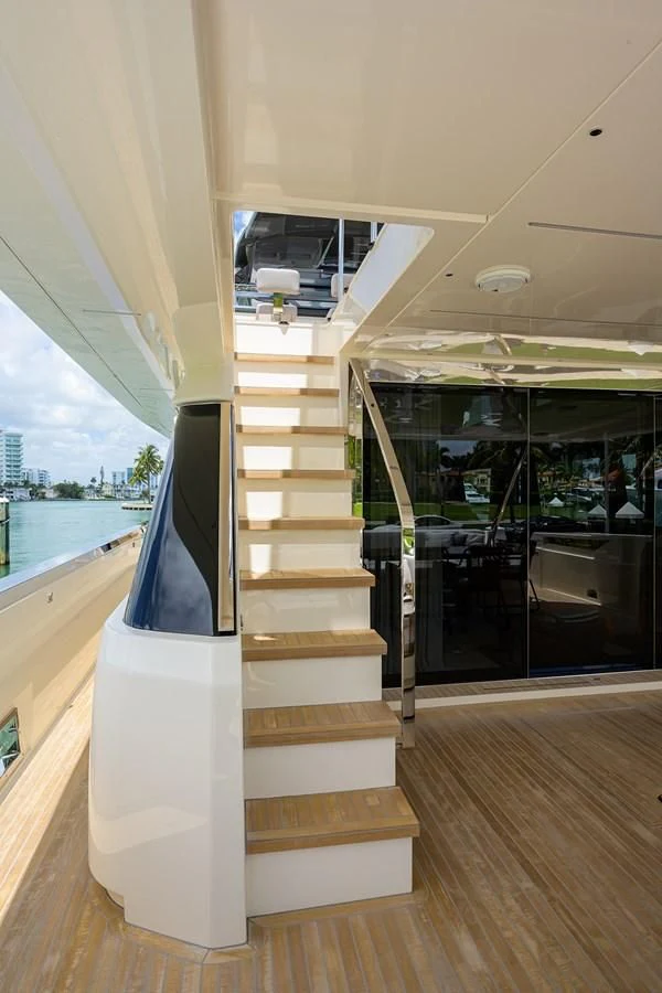 a glass door leading to a balcony aboard DATE NIGHT Yacht for Sale