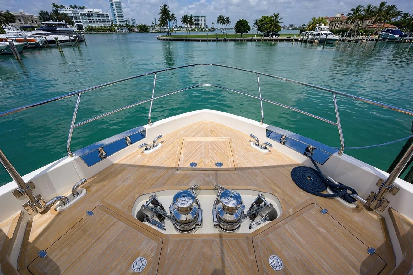 a swimming pool with boats and people on the deck aboard DATE NIGHT Yacht for Sale