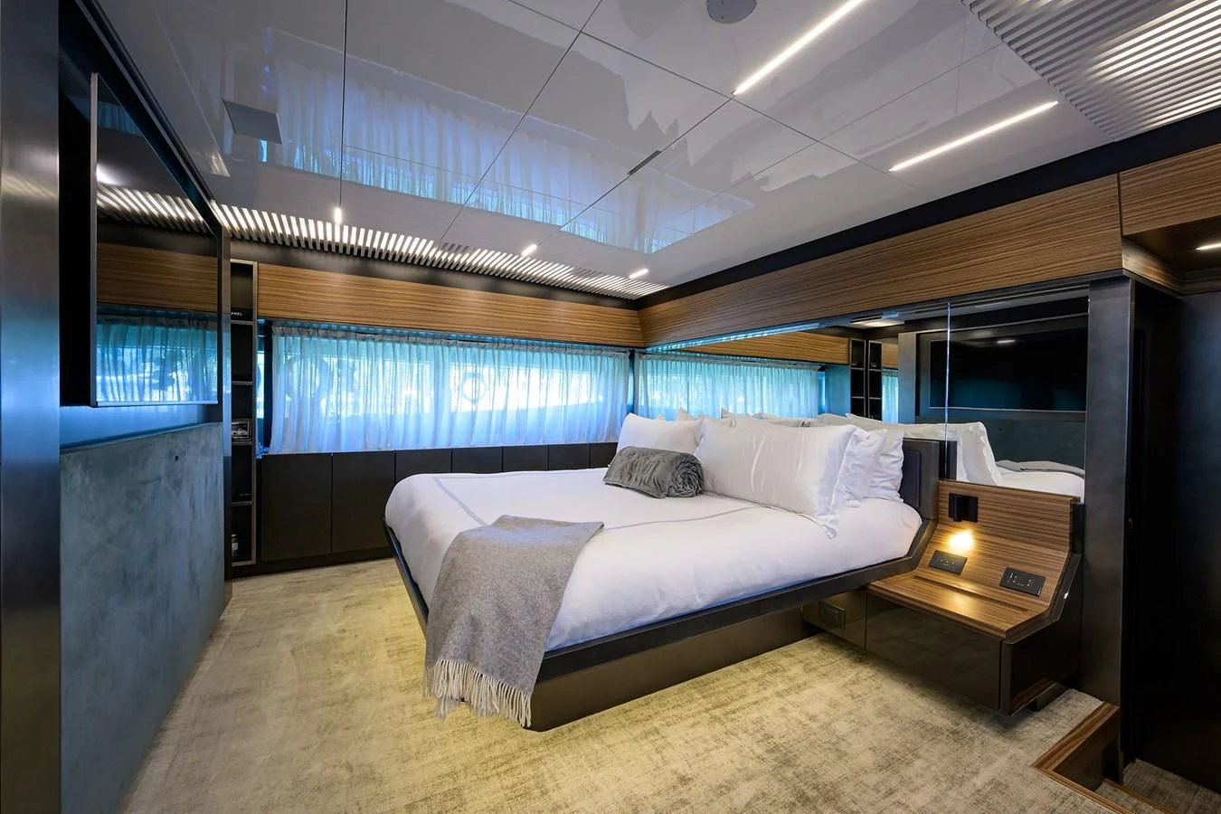a bedroom with a bed and a desk aboard DATE NIGHT Yacht for Sale