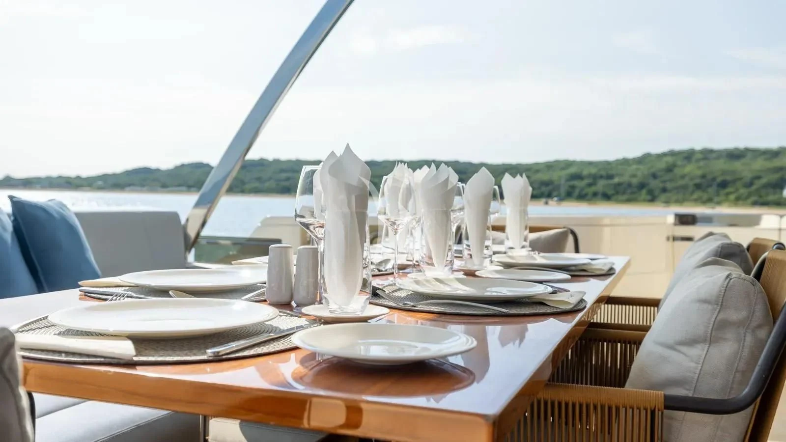 a table with plates and napkins on it aboard DATE NIGHT Yacht for Sale