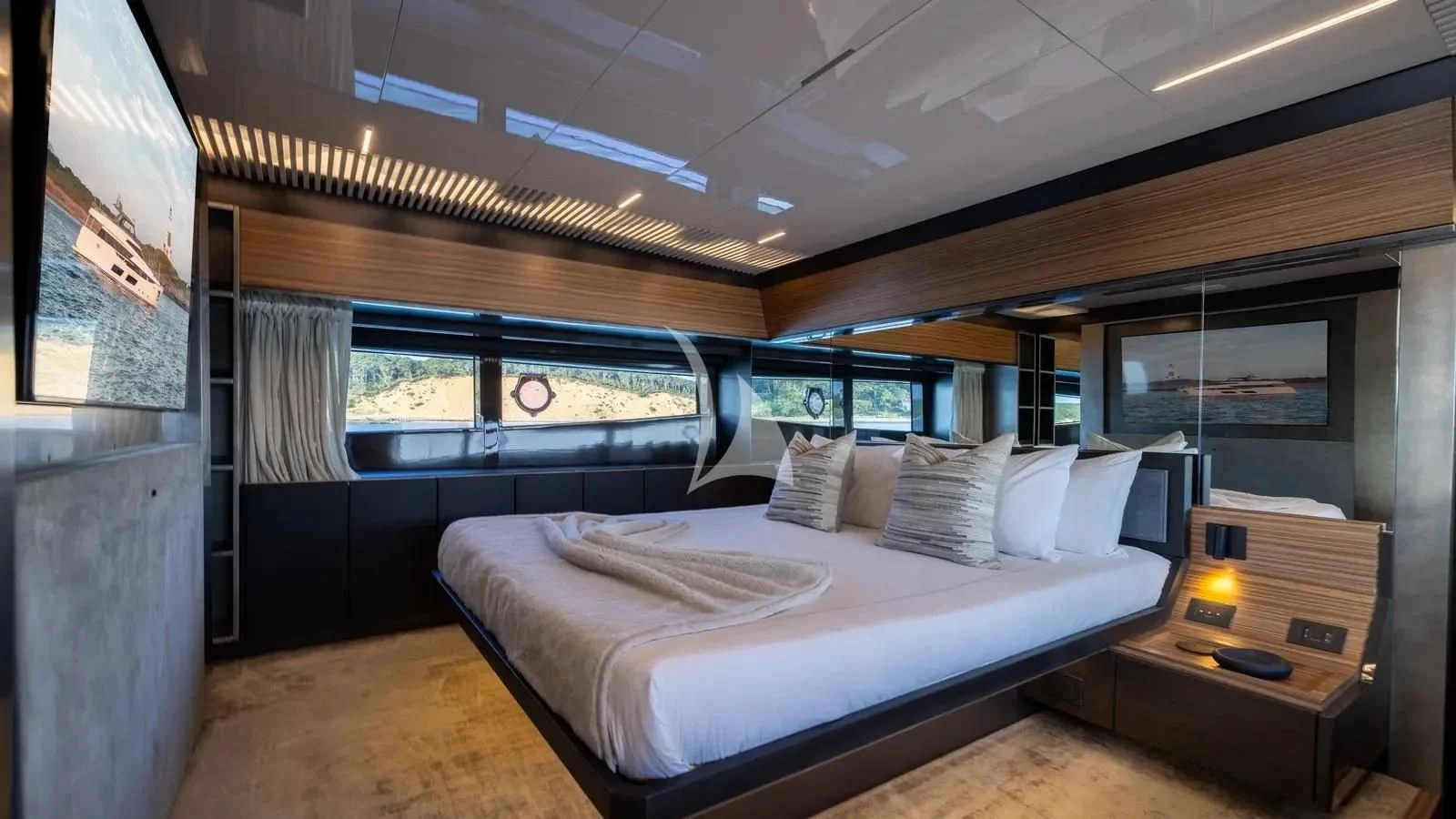 a room with a bed and a desk aboard DATE NIGHT Yacht for Sale