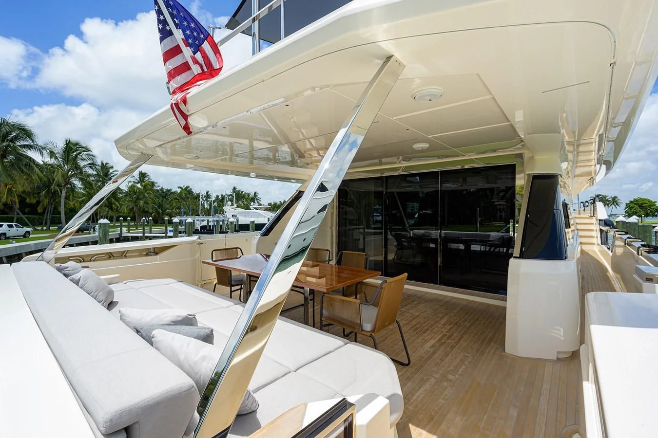 a large white tent with chairs and tables outside aboard DATE NIGHT Yacht for Sale