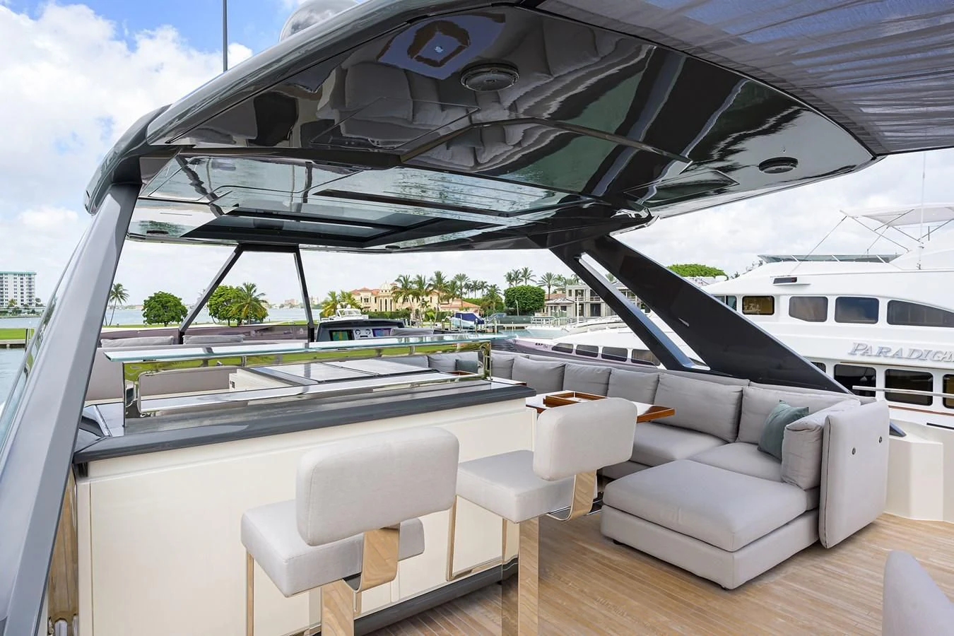a large lounge area with a large swimming pool and a deck with chairs aboard DATE NIGHT Yacht for Sale