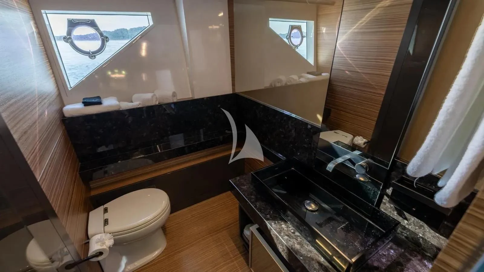 a bathroom with a tub sink and toilet aboard DATE NIGHT Yacht for Sale