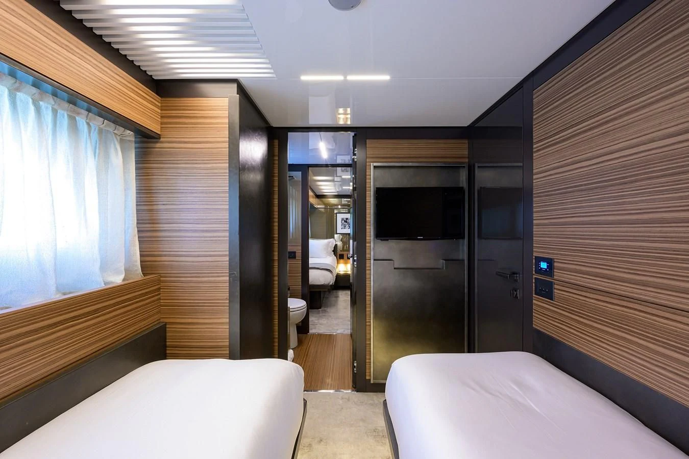 a room with a bed and a door aboard DATE NIGHT Yacht for Sale