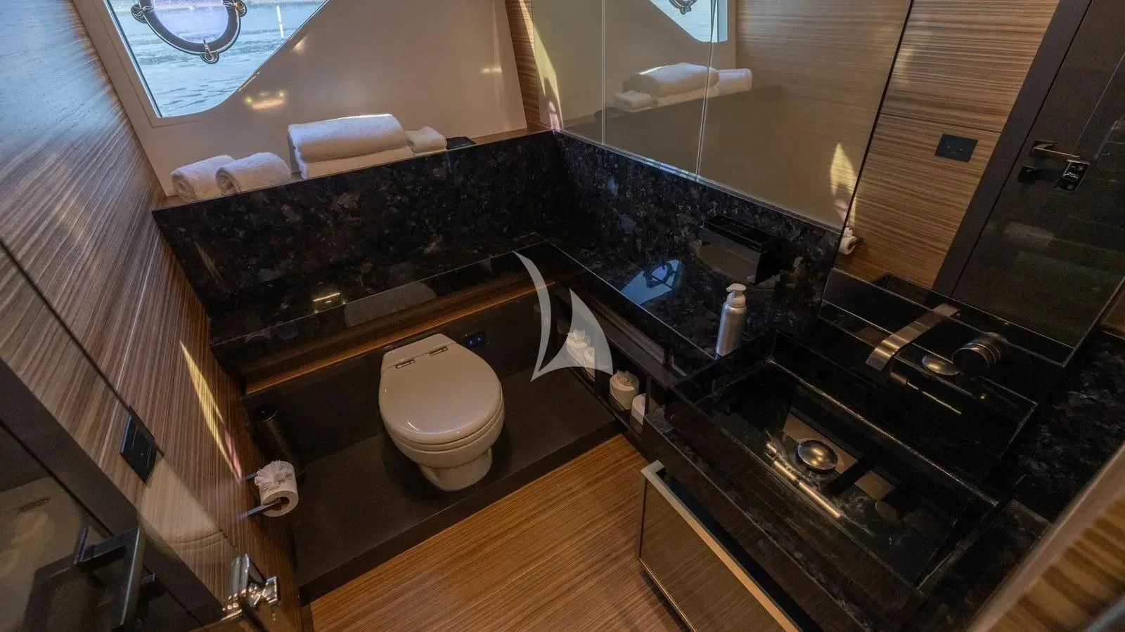 a bathroom with a countertop sink and a toilet aboard DATE NIGHT Yacht for Sale