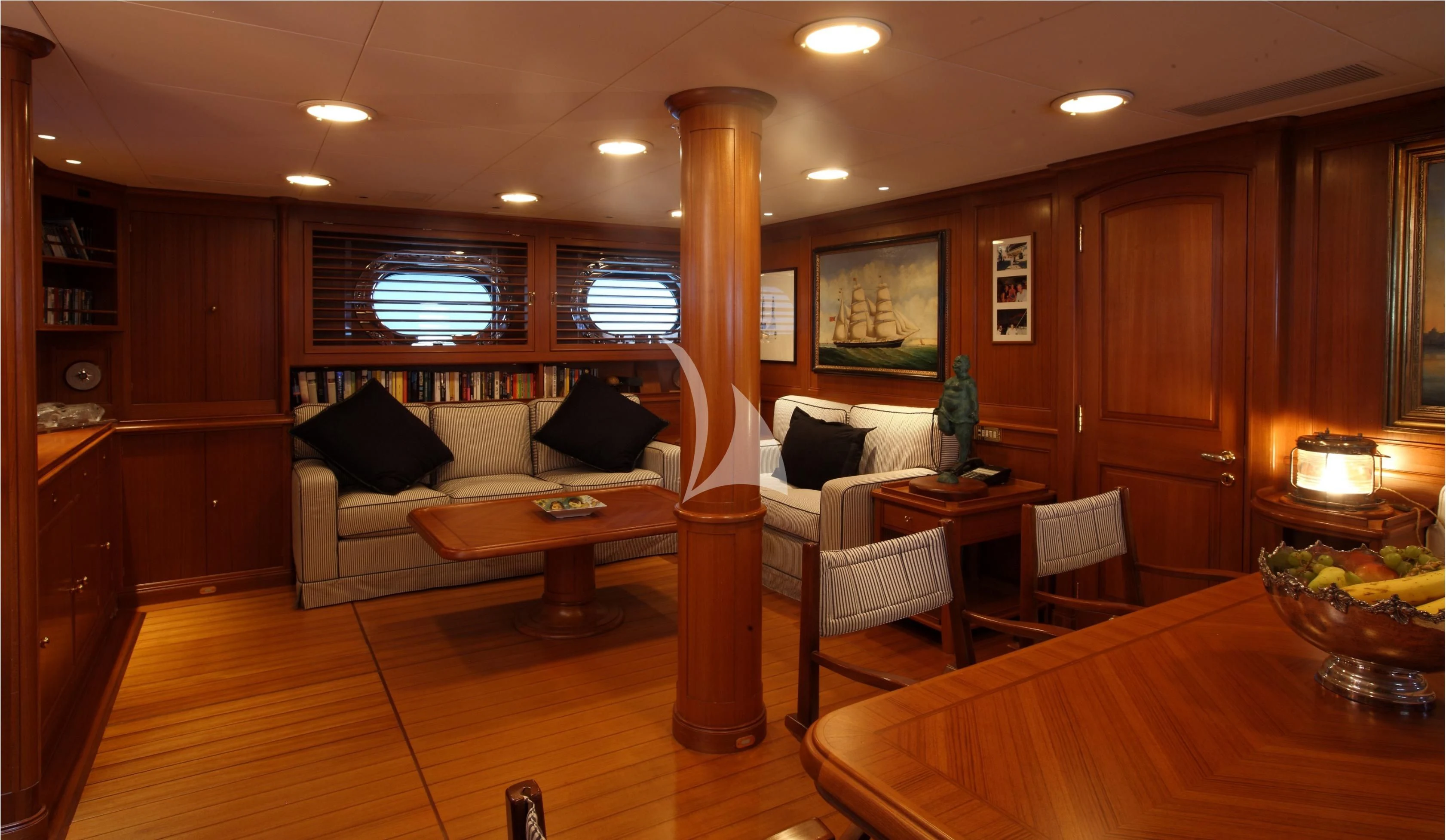 a living room with a couch and a table aboard HERITAGE M Yacht for Charter