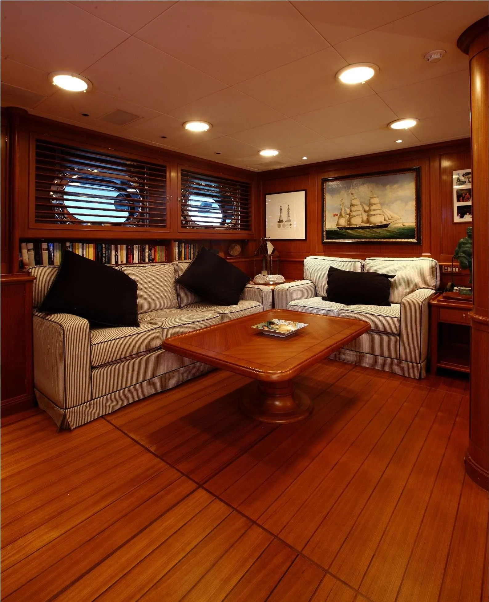 a living room with a couch and a coffee table aboard HERITAGE M Yacht for Charter