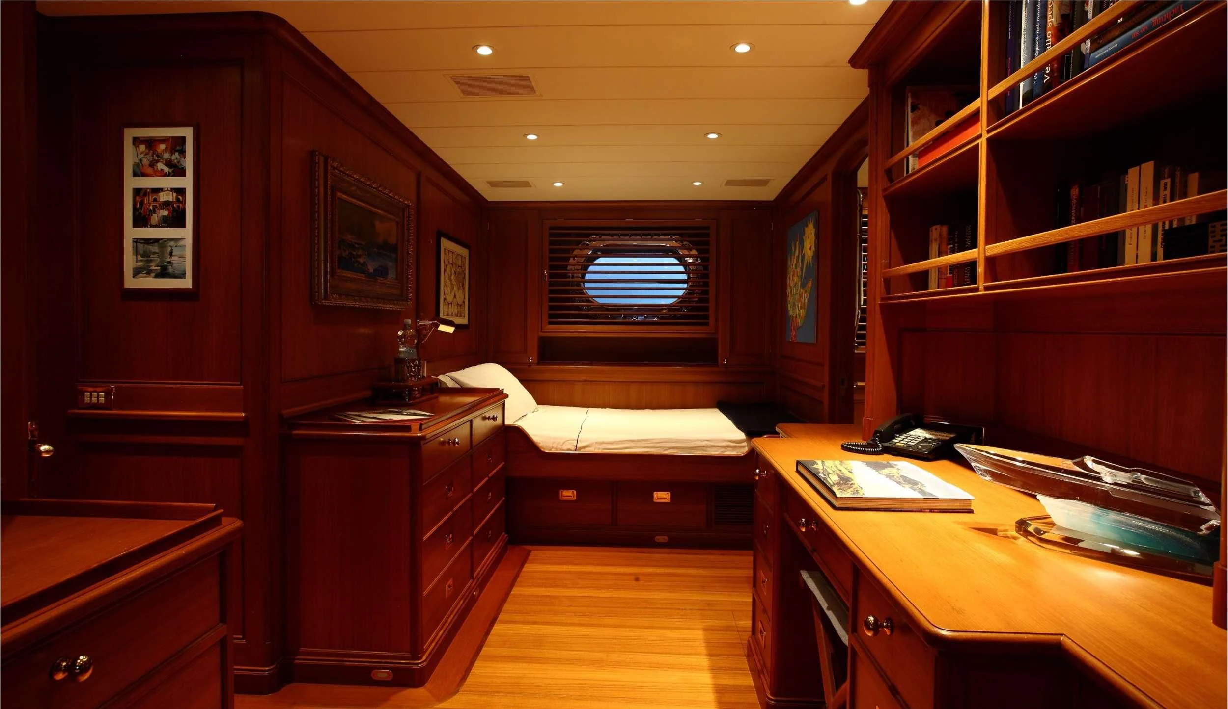 a room with a desk and a bed aboard HERITAGE M Yacht for Charter