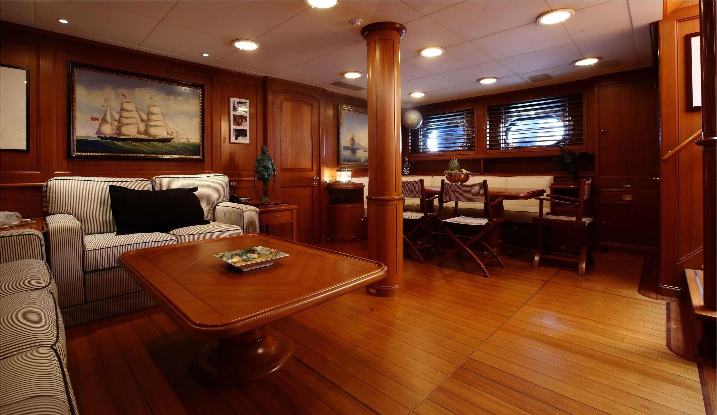a living room with a wood floor aboard HERITAGE M Yacht for Charter