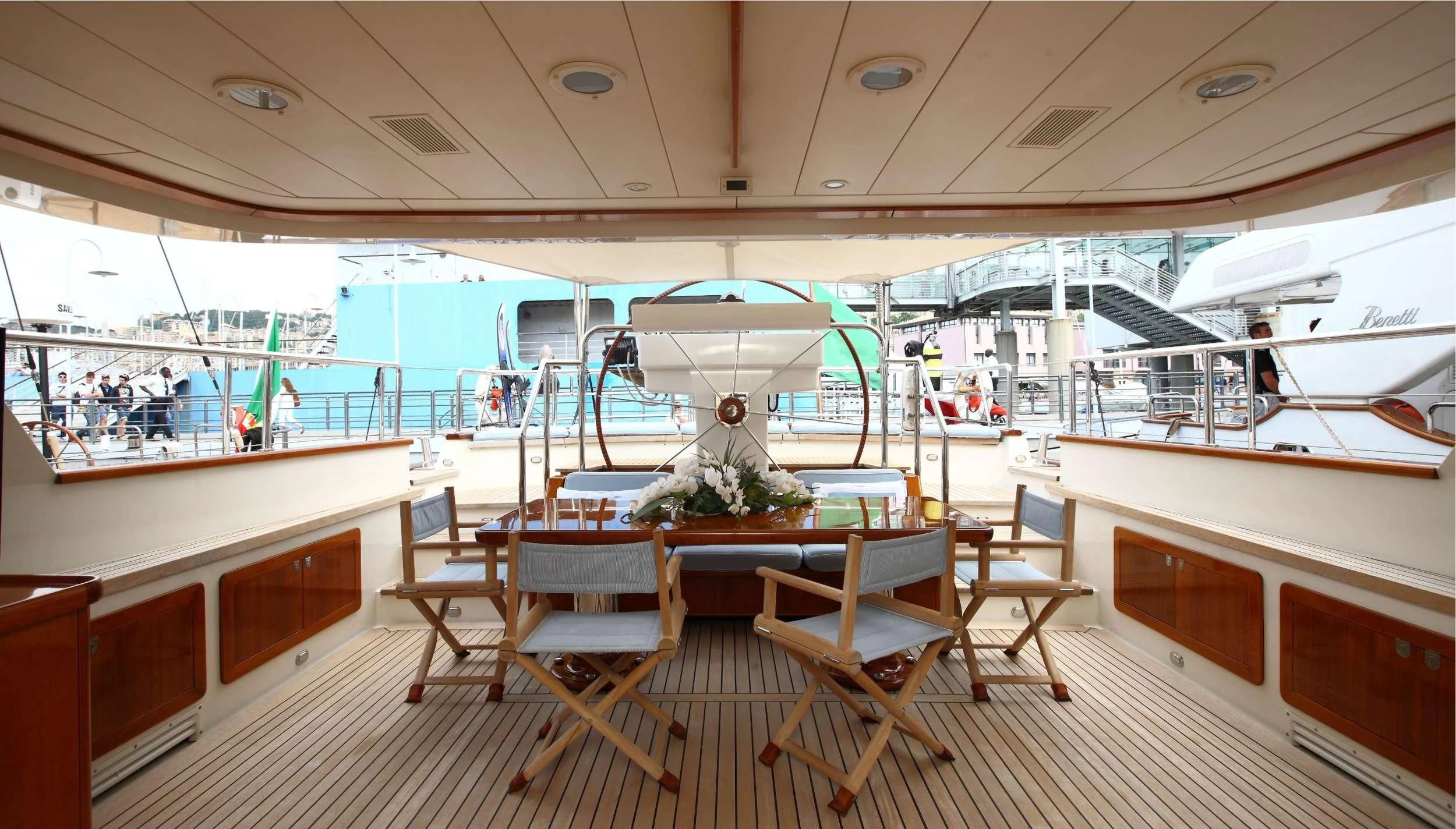 a room with tables and chairs aboard HERITAGE M Yacht for Charter