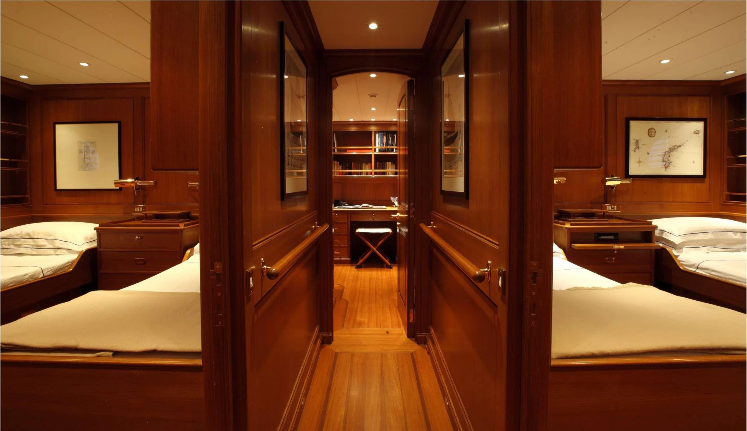 a room with a bed and a mirror aboard HERITAGE M Yacht for Charter