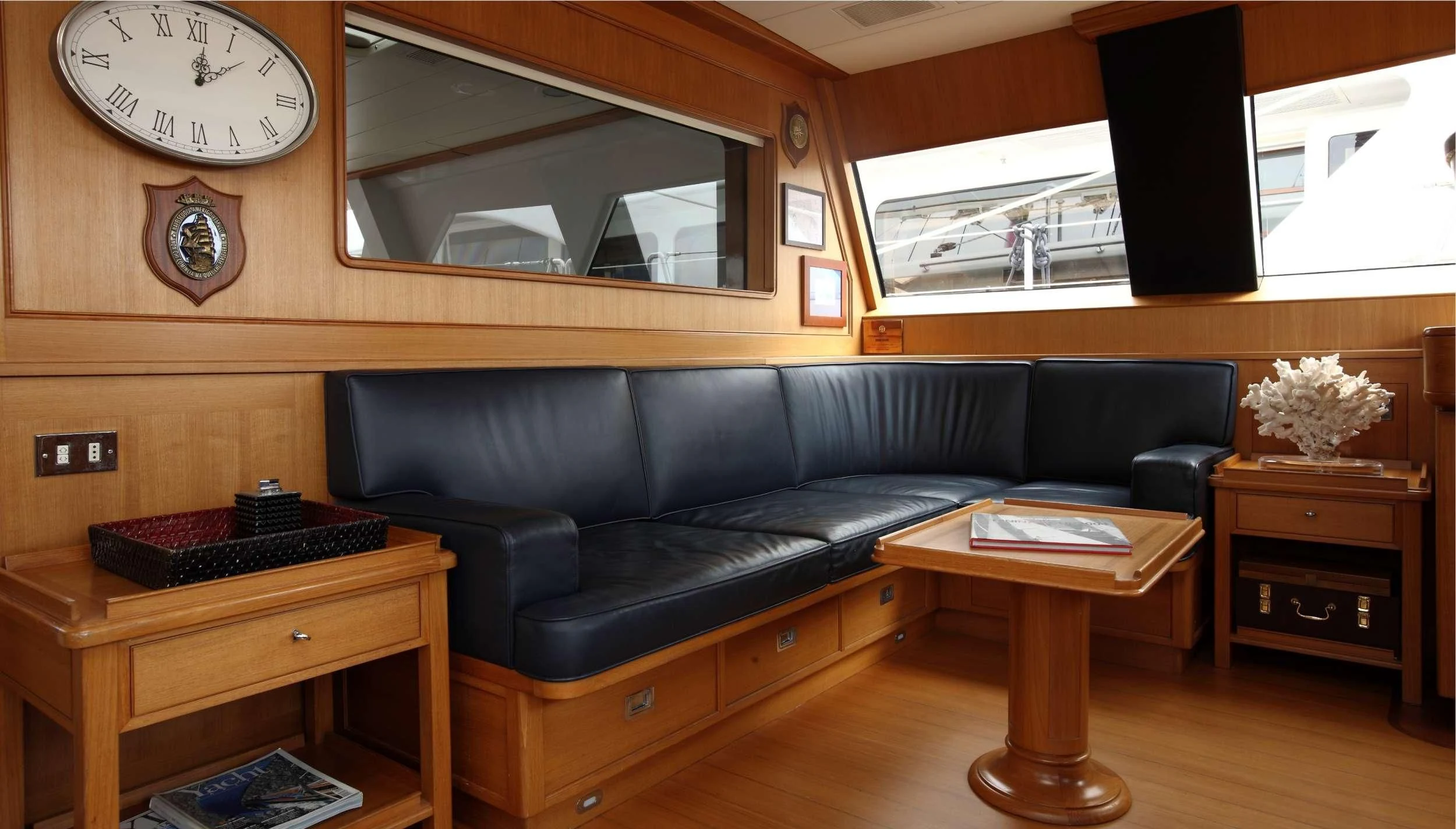 a living room with a couch and a coffee table aboard HERITAGE M Yacht for Charter